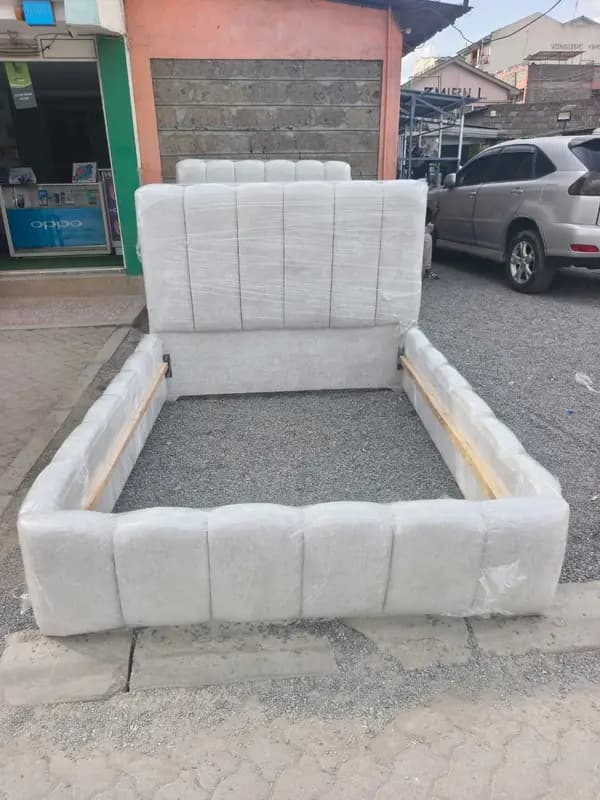 Modern upholstered queen size bed frame with tall padded headboard